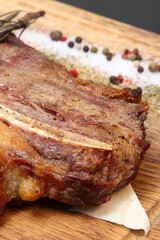Steak placed on pita bread on a special wooden board. Beef steak on a wooden board.