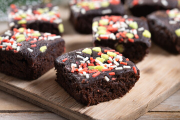 Christmas brownie on wooden table. Close up