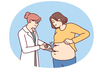 Woman nutritionist measures size of fat layer in overweight patient to give recommendations on dietary. Girl visits nutritionist or plastic surgery clinic and wants to do liposuction to become slim