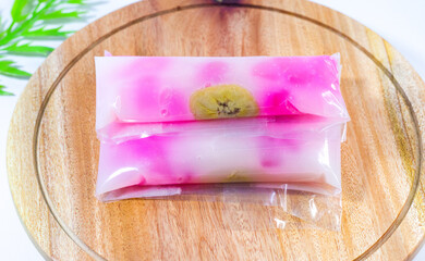 caktik manis cake, traditional Indonesian cakes placed on a wooden tray