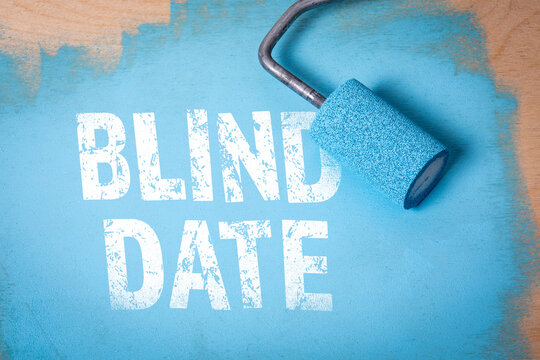 Blind Date. Blue paint and paint roller on wooden background