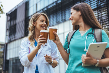 Friendly Medical Professionals Sharing Coffee Break Outdoors