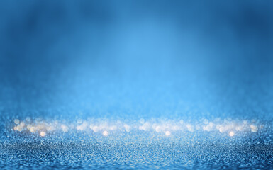 Shiny blue glitter texture background with blurred bokeh lights. Abstract festive background with...