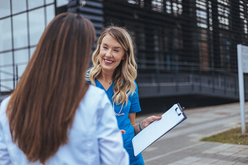 Cheerful Medical Professionals Engaging in an Outdoor Discussion