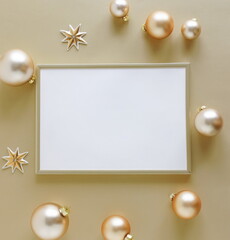 Gold frame blank mockup with copy space top view and gold Christmas decoration on golden background . Xmas background