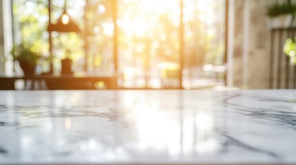 Close up of a white marble countertop in a contemporary kitchen with sunlight streaming through a window and a blurred background High quality image