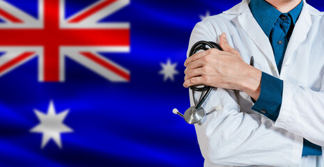 Doctor with stethoscope on Australia flag. Male Doctor holding stethoscope on Australian flag