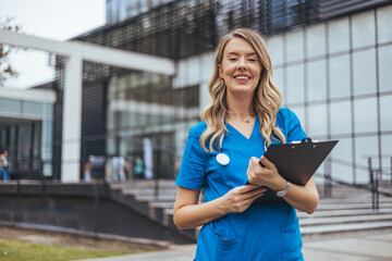 Smiling Medical Professional Holding Clipboard Outside Modern Building