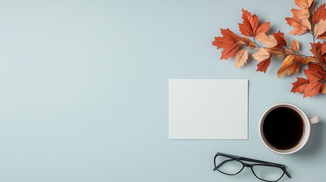 Create a cozy workspace with autumn decor, coffee, and personal touches for enhanced productivity