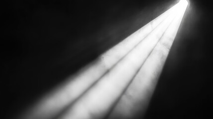 Close up of a light beam illuminating an unoccupied stage with ample space for text