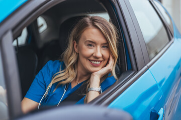 Smiling Woman Sitting in Car and Looking Out the Window