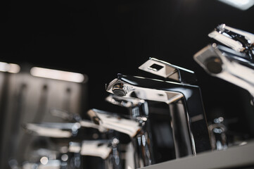 Rows of new faucets in plumbing shop