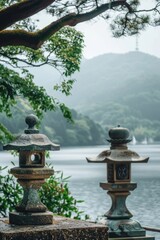 Fototapeta premium A pair of stone lanterns perched on top of a stone wall, with intricate carvings and details
