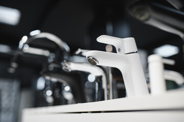 Modern kitchen and bathroom water faucets in the store