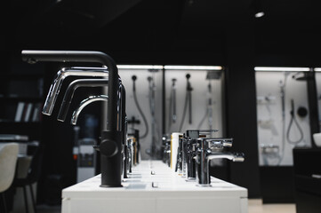 Modern kitchen and bathroom water faucets in the store