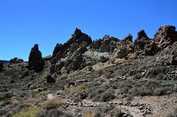 Scenic view of volcanic rock formations in desert during sunny day, Teide National Park, Tenerife