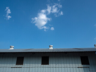Roof ventilator on the roof with blue sky..