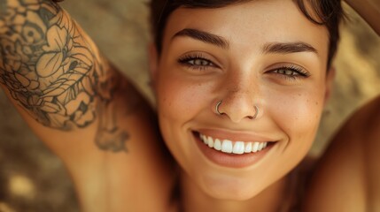 Close Up Portrait of Smiling Tattooed Woman with Nose Stud and Short Hair Outdoors