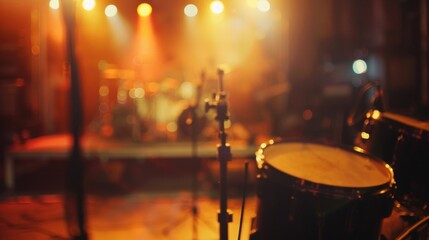 The blurred stage setup adds to the sense of anticipation and excitement as the music builds.