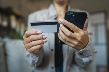 Adult woman use smart phone for online shopping transaction safely