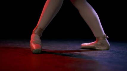 Professional ballerina dancing in dance room, closeup view of feet, slow motion . Beautiful classic dance, ballet performance in theatre or in rehearsal hall, art and beauty, silk pointe shoes on legs