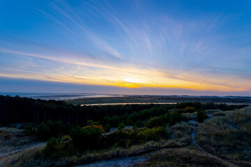The sand dunes with marram beach grass, Evening sunset skyline at viewpoint, The Dutch Wadden Sea Terschelling, A municipality and an island in the northern, Friesland, West-Terschelling, Netherlands.