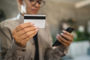 Adult woman use smart phone for online shopping transaction safely