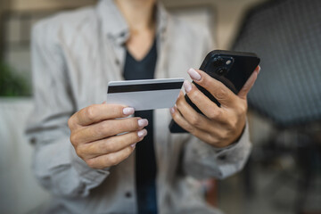 Adult woman use smart phone for online shopping transaction safely