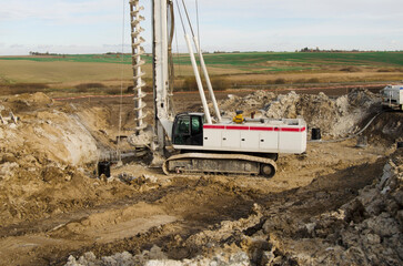 Building activity on contruction site.Drilling machine.Wind turbine construction.