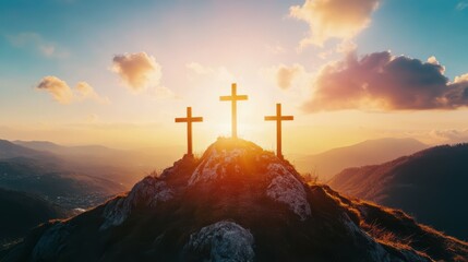 Three crosses on top of the mountain in the sunlight. Christian symbols.