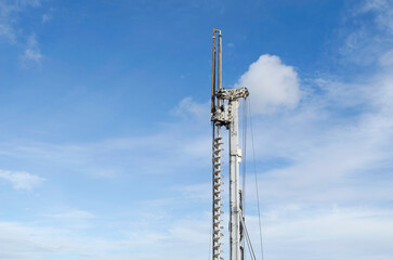 Building activity on contruction site.Drilling machine.Wind turbine construction.