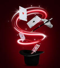 Magician showing trick with magic wand on red background. Playing cards and light flying out of top...