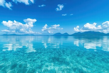 Reflections of scattered clouds on a clear, shimmering body of water, enhancing the visual depth