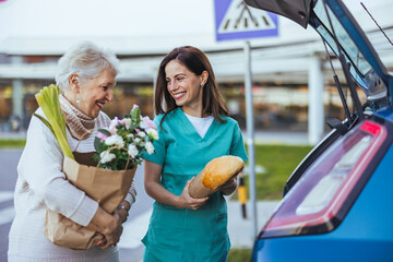 Elderly Woman Grocery Shopping With Caregiver Assistance