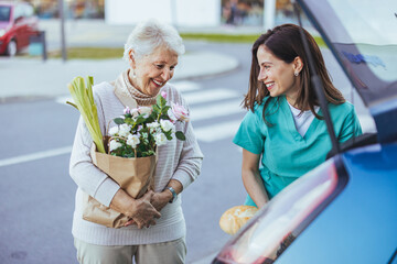 Elderly Woman and Caregiver Sharing a Joyful Moment