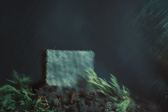Wooden cube resting on moss and pine needles, viewed through textured glass with blur and rain effect.