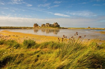 Autumn landscape in Brittany. Rocky coast with grass. PLOUGRESCANT, FRANCE Rocky coast, Cote de Granit Rose, Bretagne (Brittany), Castel Meur, France.