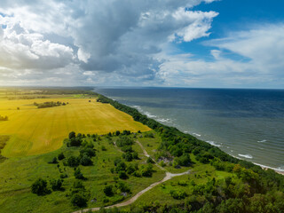 Aerial view of calm and wild Saka beach with a clear blue water on a cloudy summer day. Beautiful...