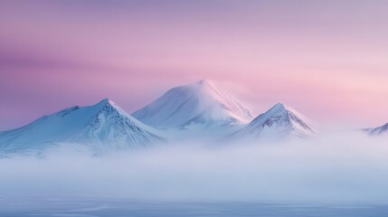 Majestic Mountain Peaks Rise Above a Sea of Mist, Bathed in a Soft, Pastel Pink Dawn