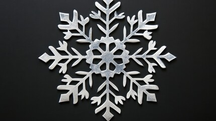 Elegant silver snowflake on dark background perfect for winter holiday decoration