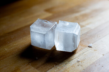 ice cubes on wooden table