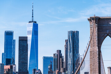 Brooklyn, New York, USA – October 28, 2024: People walk across the Brooklyn Bridge toward lower Manhattan in New York, New York, USA.