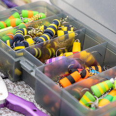 Fishing tackles and fishing baits in box .Classic Colored Fishing Lure , Beautiful Background...