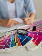 Design professional evaluating color palettes and sketching concepts