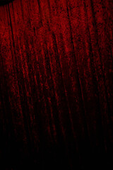 Deep crimson fabric drapes in an elegant banquet hall, creating a luxurious atmosphere