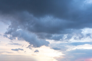 Dramatic cloudscape with a touch of sunlight against a vast blue sky