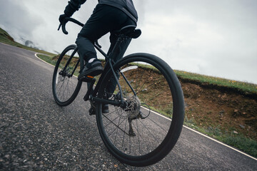 Woman riding bike on mountain top trail