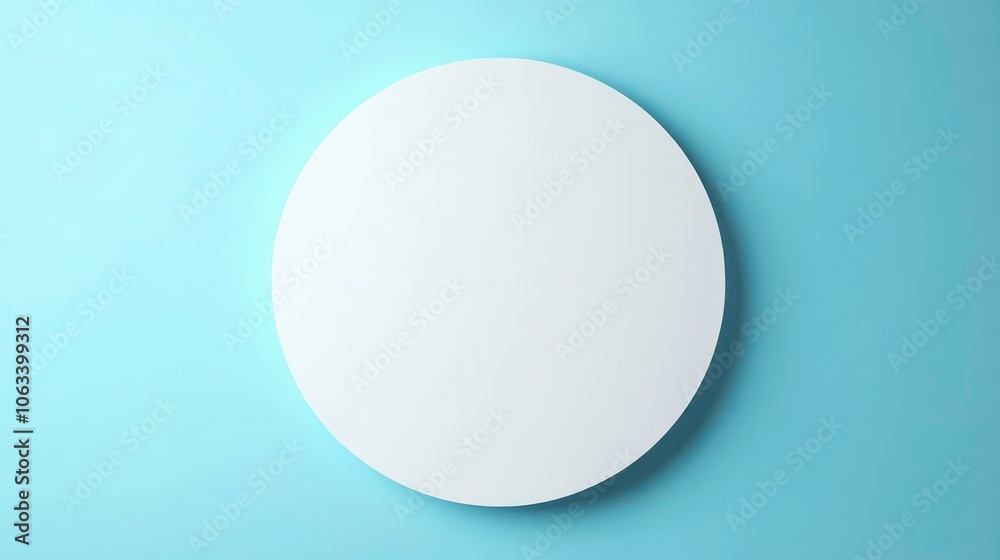 Poster a minimalistic round mirror against a light blue wall, emphasizing simplicity and design.