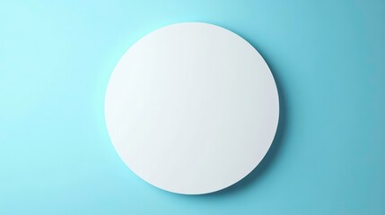 A minimalistic round mirror against a light blue wall, emphasizing simplicity and design.