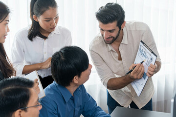 Group of diverse office worker employee working together on strategic business marketing planning in corporate office room. Positive teamwork in business workplace concept. Prudent